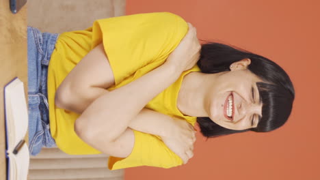 Vertical-video-of-The-young-woman-hugs-the-camera.